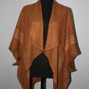 Brown textured shawl draped on a mannequin.