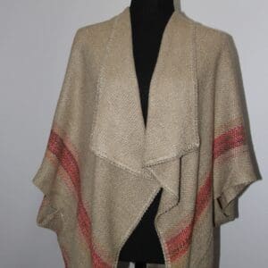 Beige shawl with colorful striped accents.