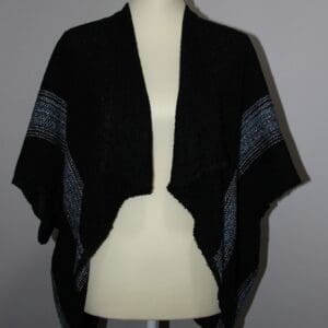 Black shawl with blue accent stripes.