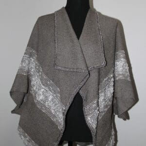 Gray shawl with white patterned edges.